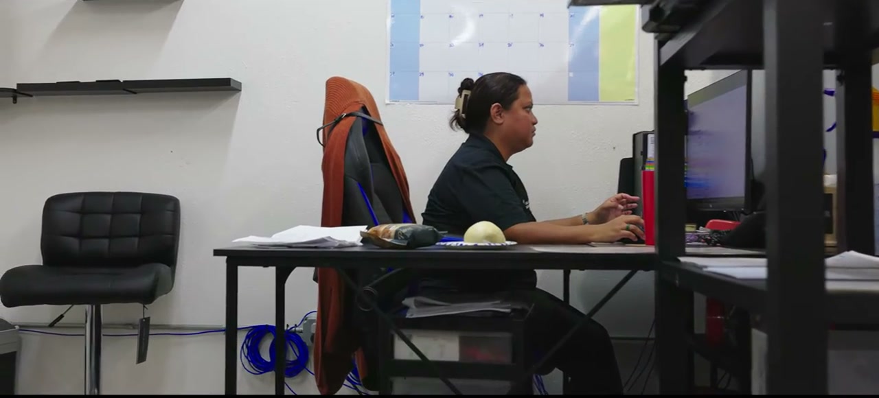 An Able Pest Management office team member at her desk